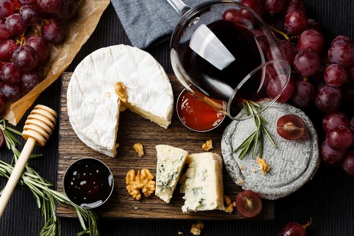 Glass of wine with a cheese board