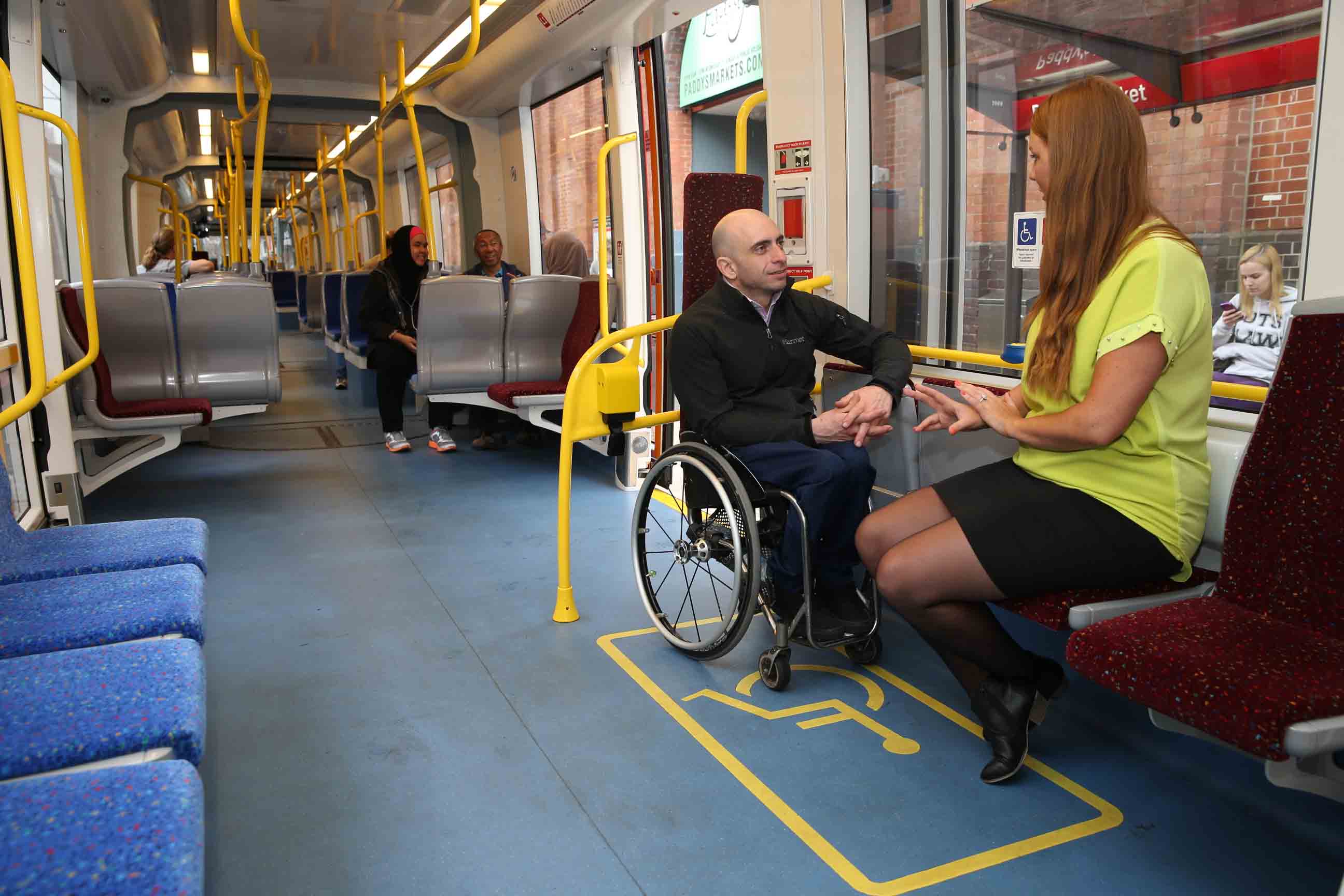 companion-attendant-man-wheelchair-light-rail-accessibility-01.jpg