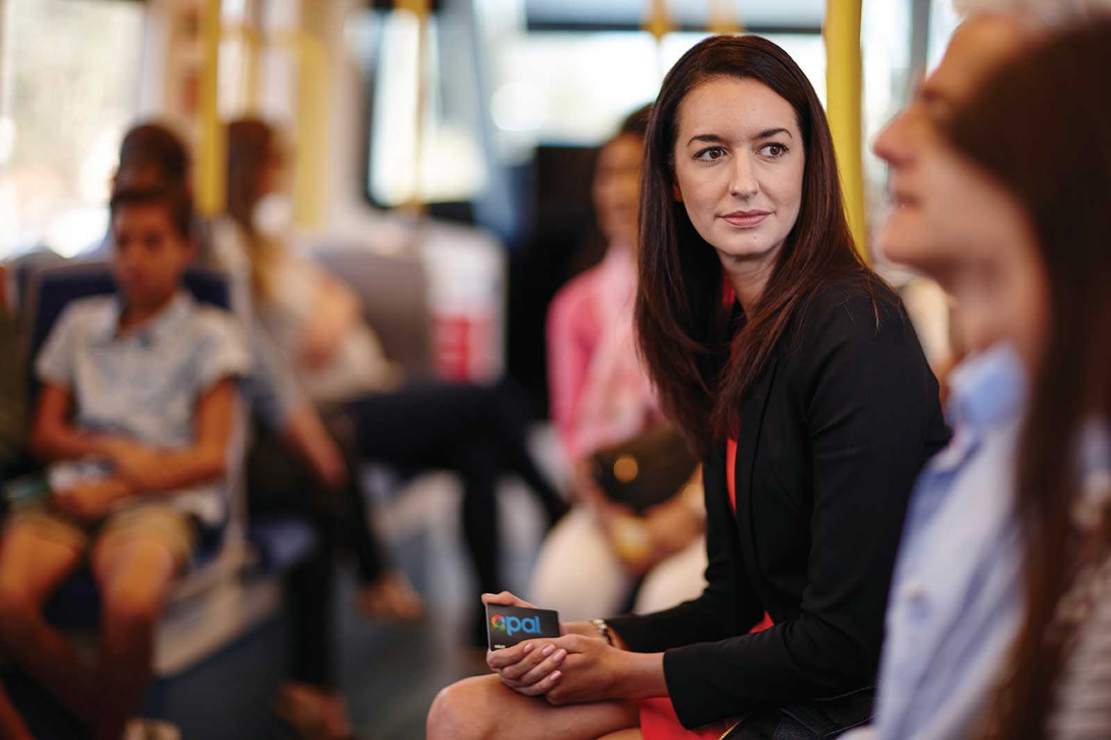 Adult woman on bus with Opal card