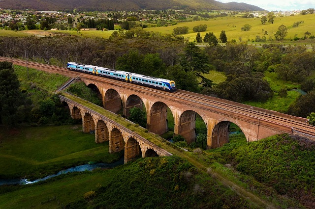 Xplorer train passing over bridge