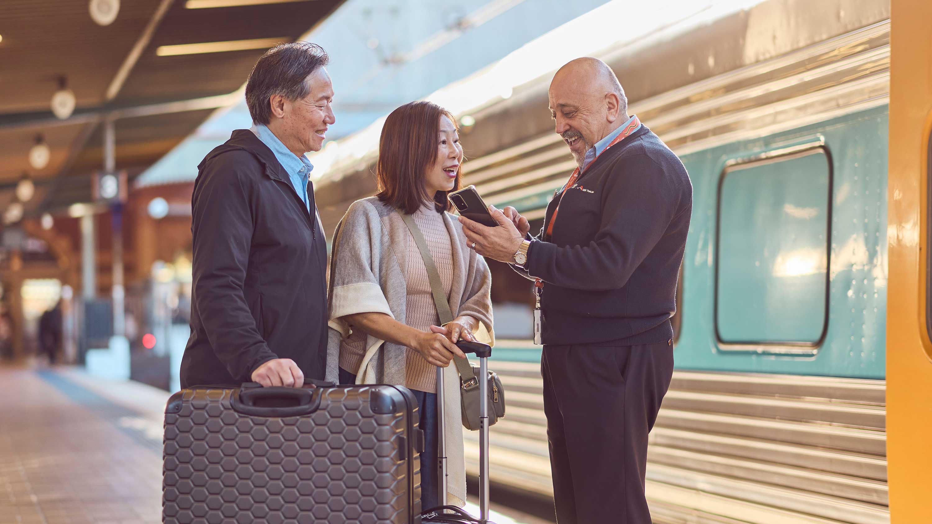 122586-2-couple-trainlink-luggage-station.jpg