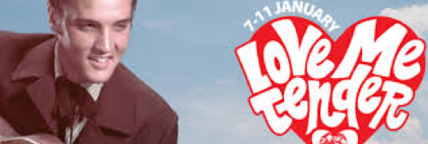 Picture of Elvis with guitar with Love Me Tender written in a red heart 