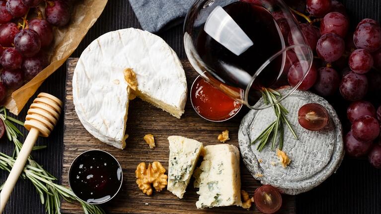 Glass of wine with a cheese board