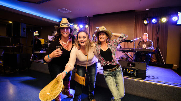 Girls at hats off to country