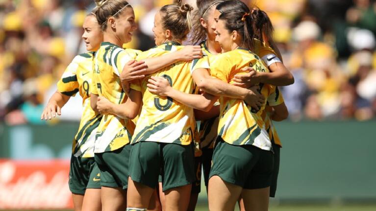 matildas players in group huddle