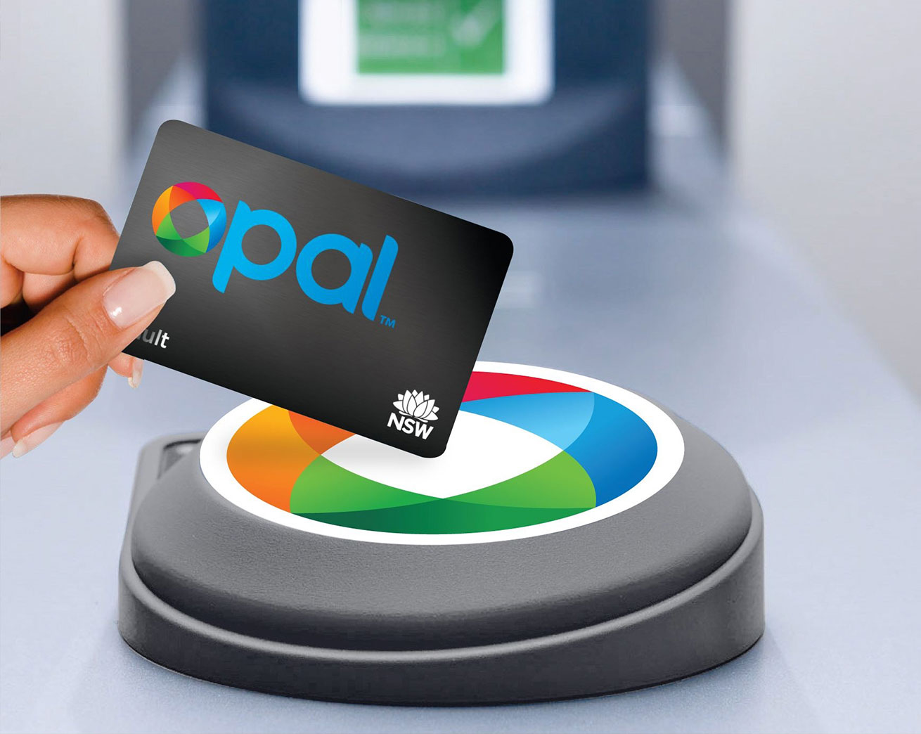 Adult Opal card tapping on an Opal card reader